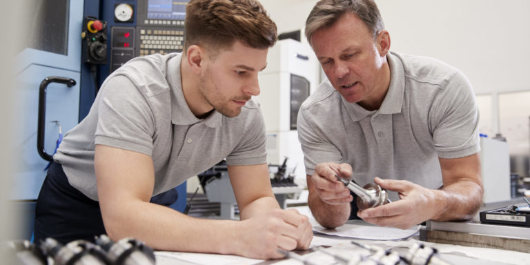 Engineer Showing Apprentice How To Measure CAD Drawings What is it like being a MAT² Apprentice?