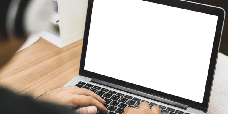 Back side of Asian business man wearing headphone and using lapt