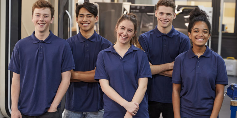 Portrait Of Engineering Apprentices In Factory